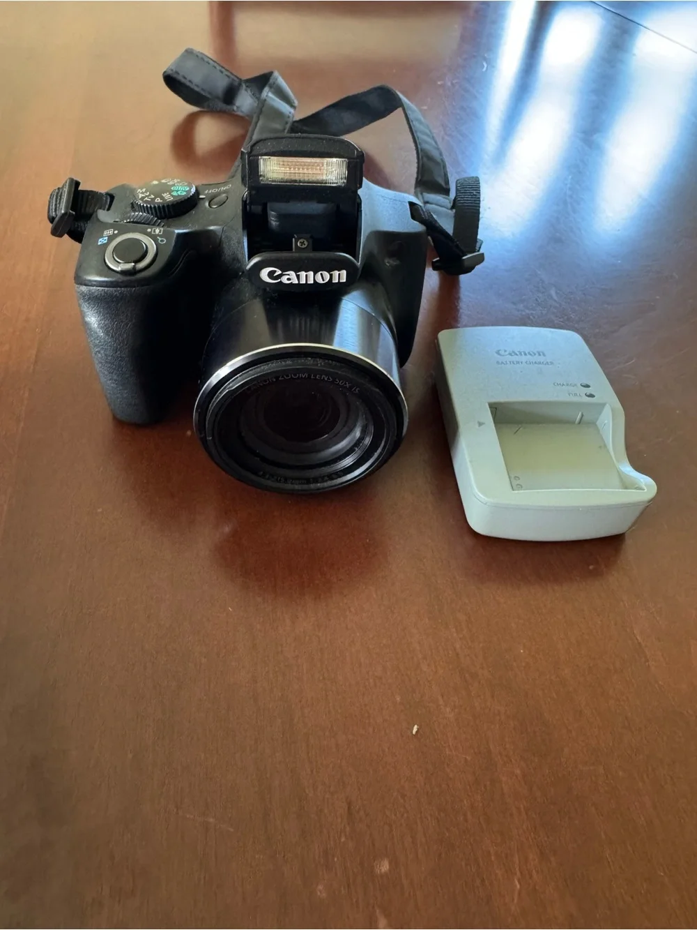 Canon Black Digital Bridge Camera with White Battery Charger